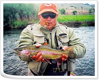 Cigar-smoking angler with Rainbow trout